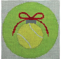 tennis ball with red bow on green